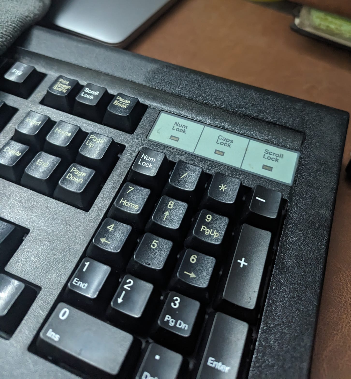 Applying ceramic wax to the plastic frame to restore its color.